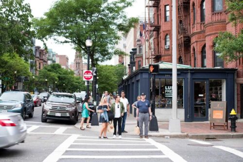 pedestrians stroll on newbury street