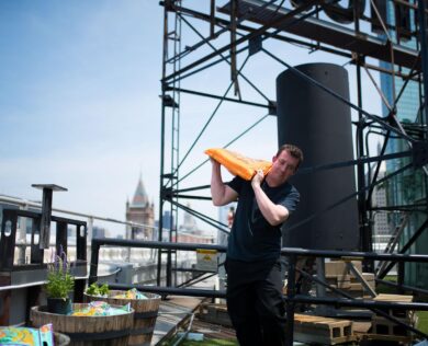 Chef Sean carrying a bag of soil